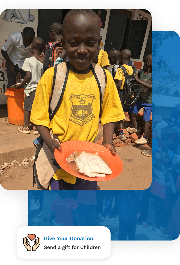 A smiling boy in a yellow school uniform holds a plate of food